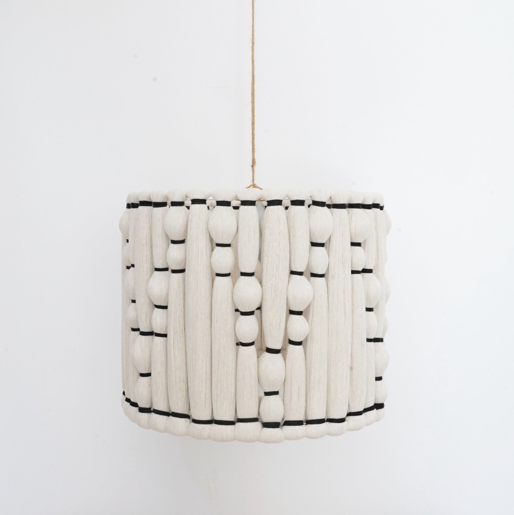 Ivory and black handcrafted cotton tassel and lampshade from the Hilo Collection