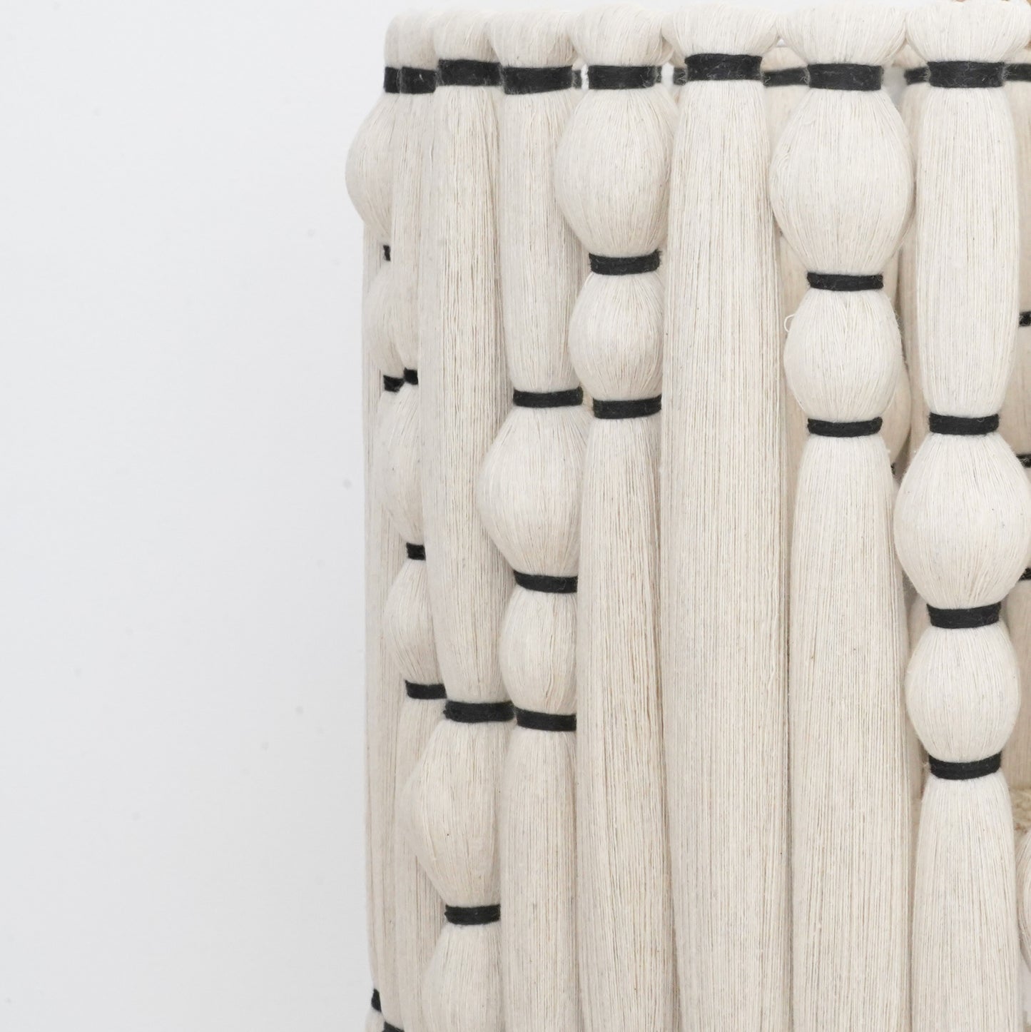 Ivory and black handcrafted cotton tassel and lampshade from the Hilo Collection