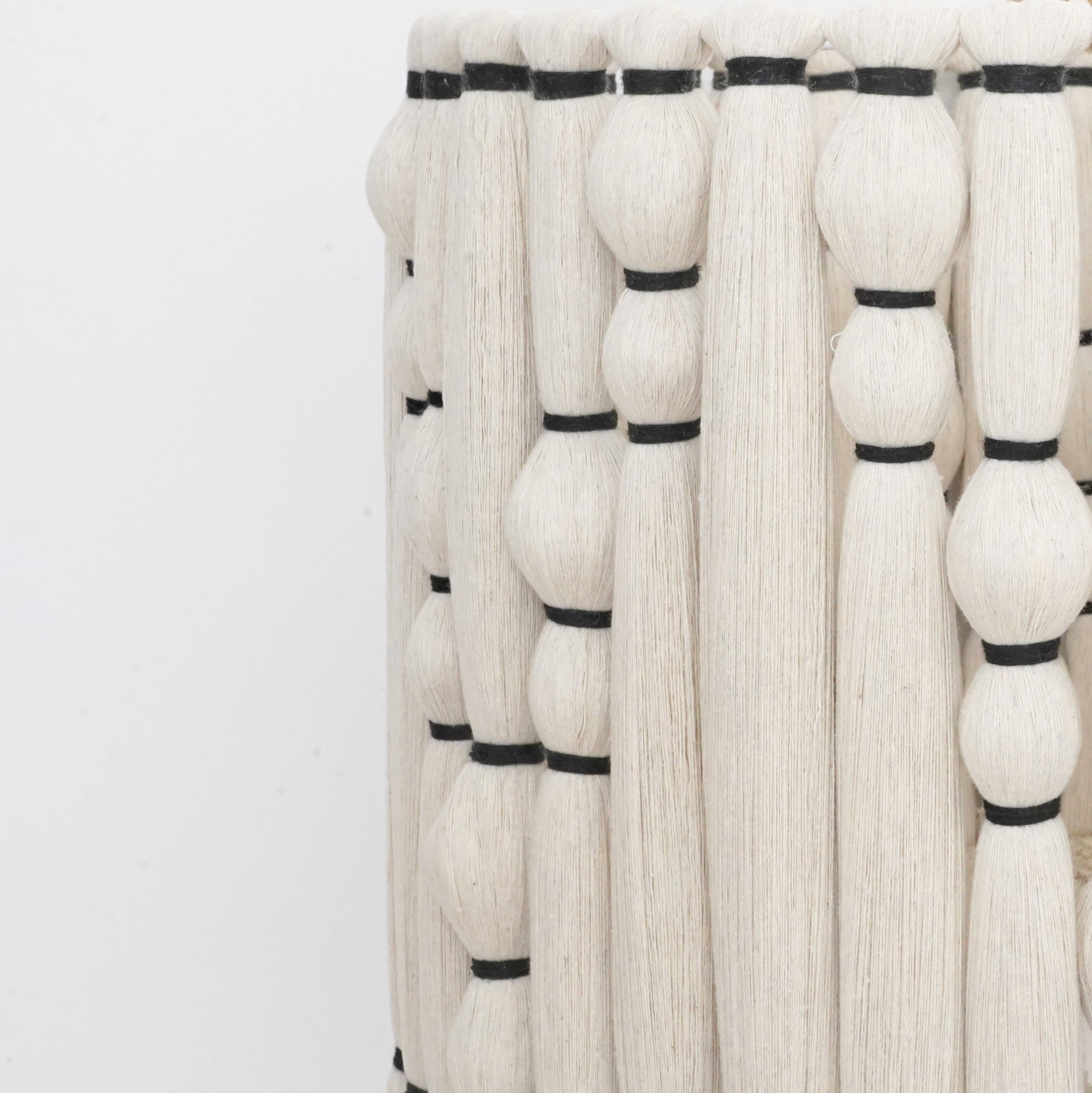 Ivory and black handcrafted cotton tassel and lampshade from the Hilo Collection