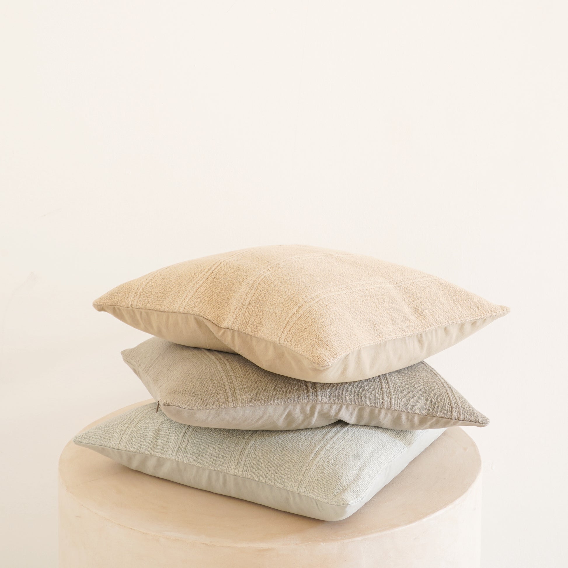 Cleo cotton-linen cushion in Ice, Shell, and Stone.