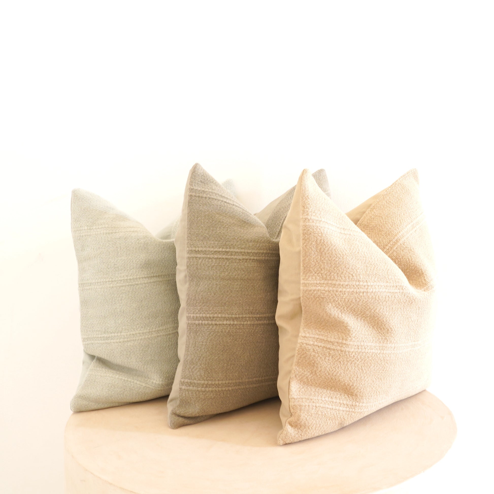 Cleo cotton-linen cushion in Ice, Shell, and Stone.