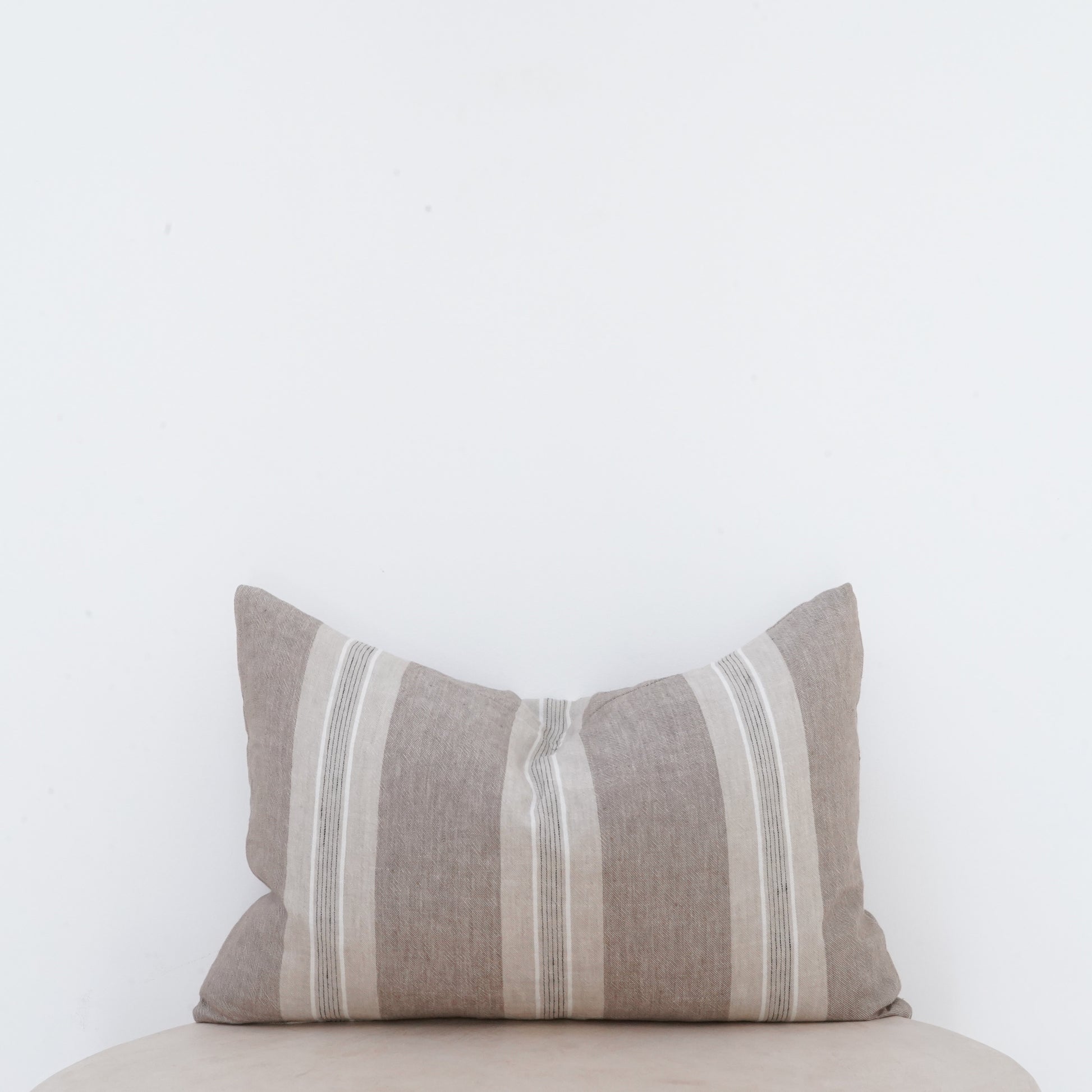 Fawn linen cushion with soft, classic European style.