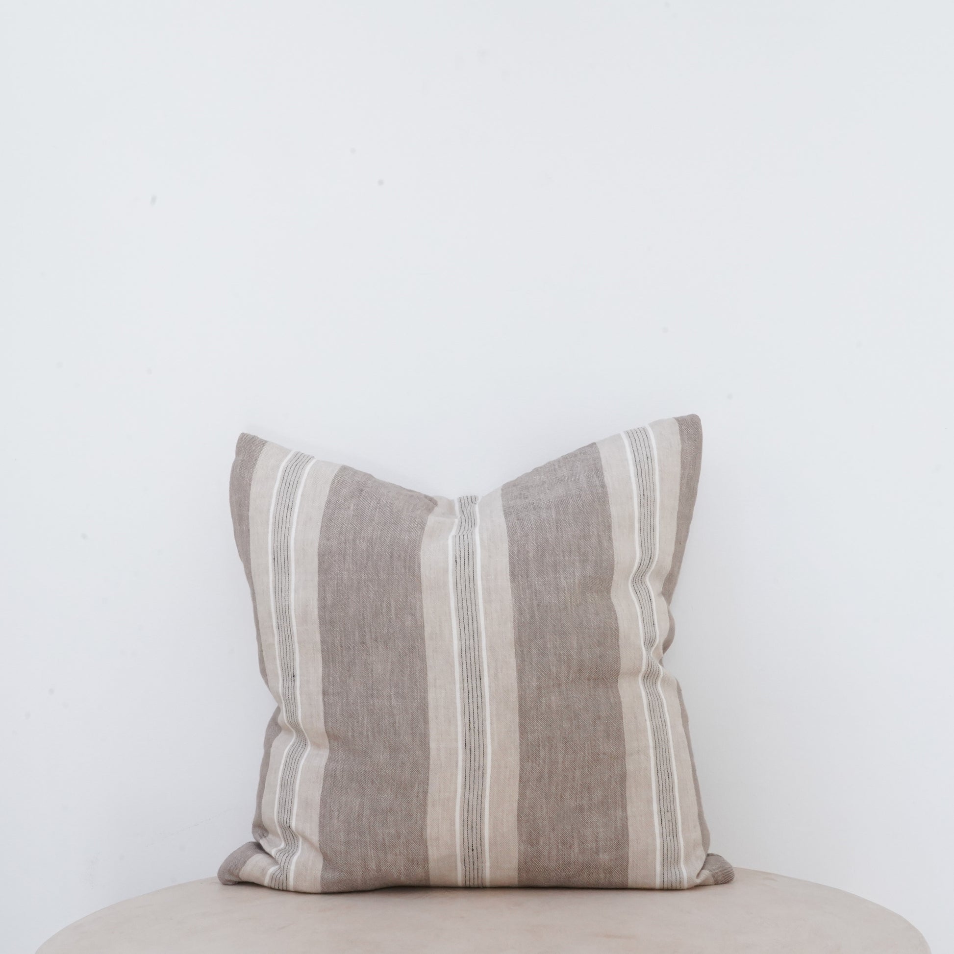 Fawn linen cushion with soft, classic European style.