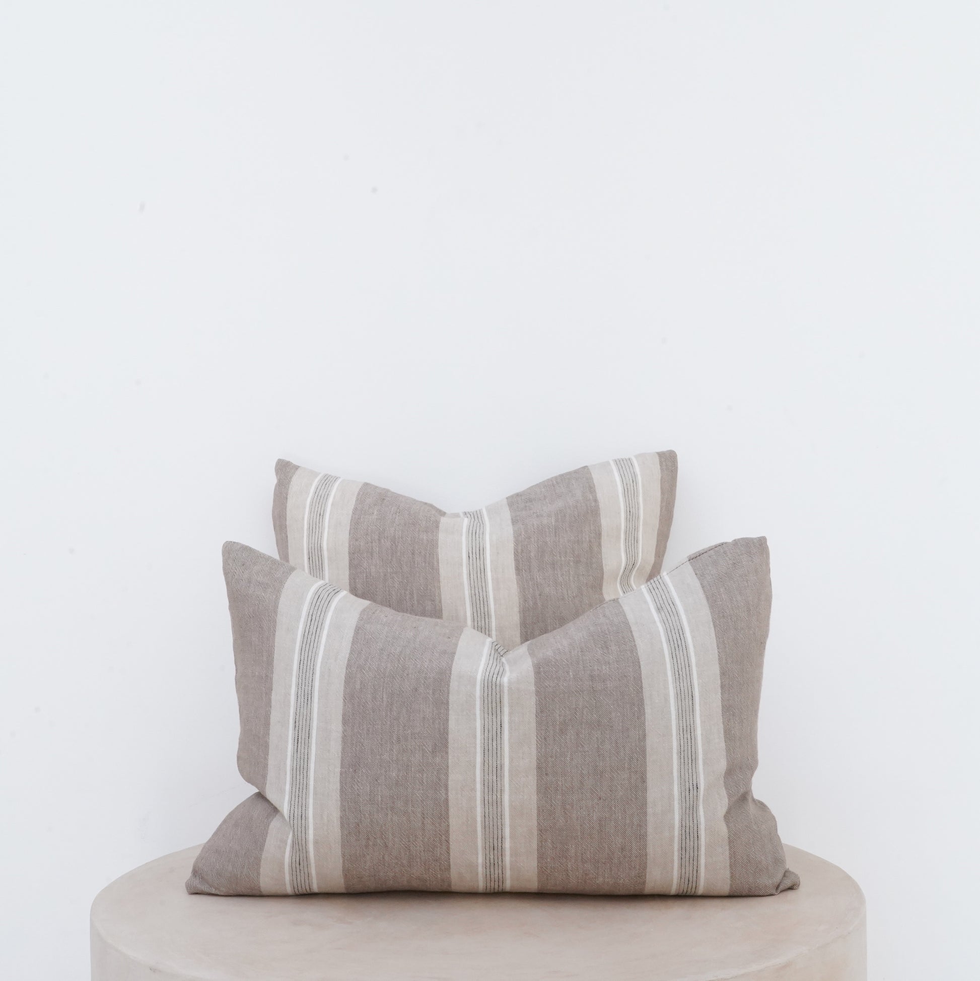 Fawn linen cushion with soft, classic European style.