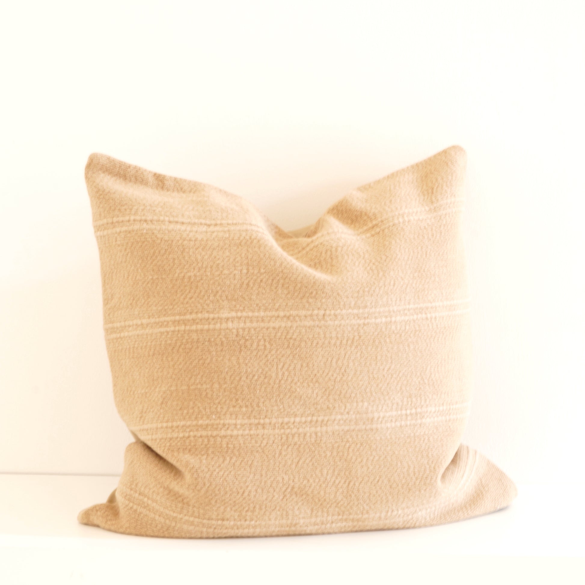 Cleo cotton-linen cushion in Ice, Shell, and Stone.