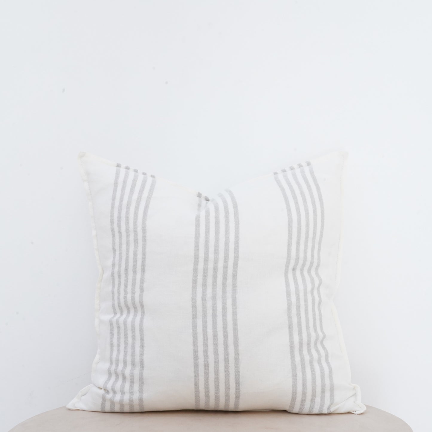 Natural linen Dove cushion with French seam detailing for elegant interiors.