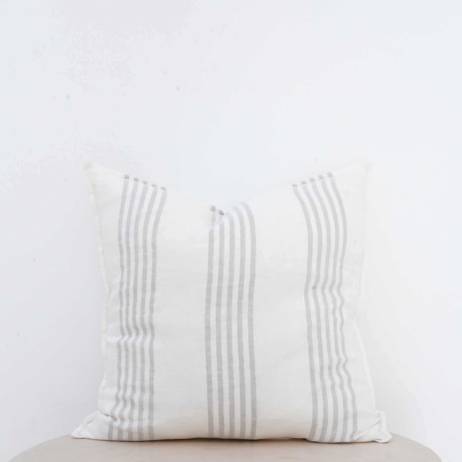 Natural linen Dove cushion with French seam detailing for elegant interiors.