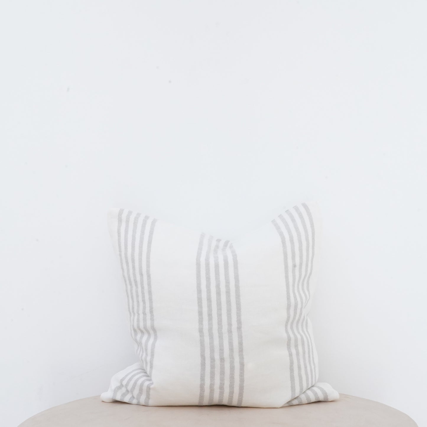 Natural linen Dove cushion with French seam detailing for elegant interiors.