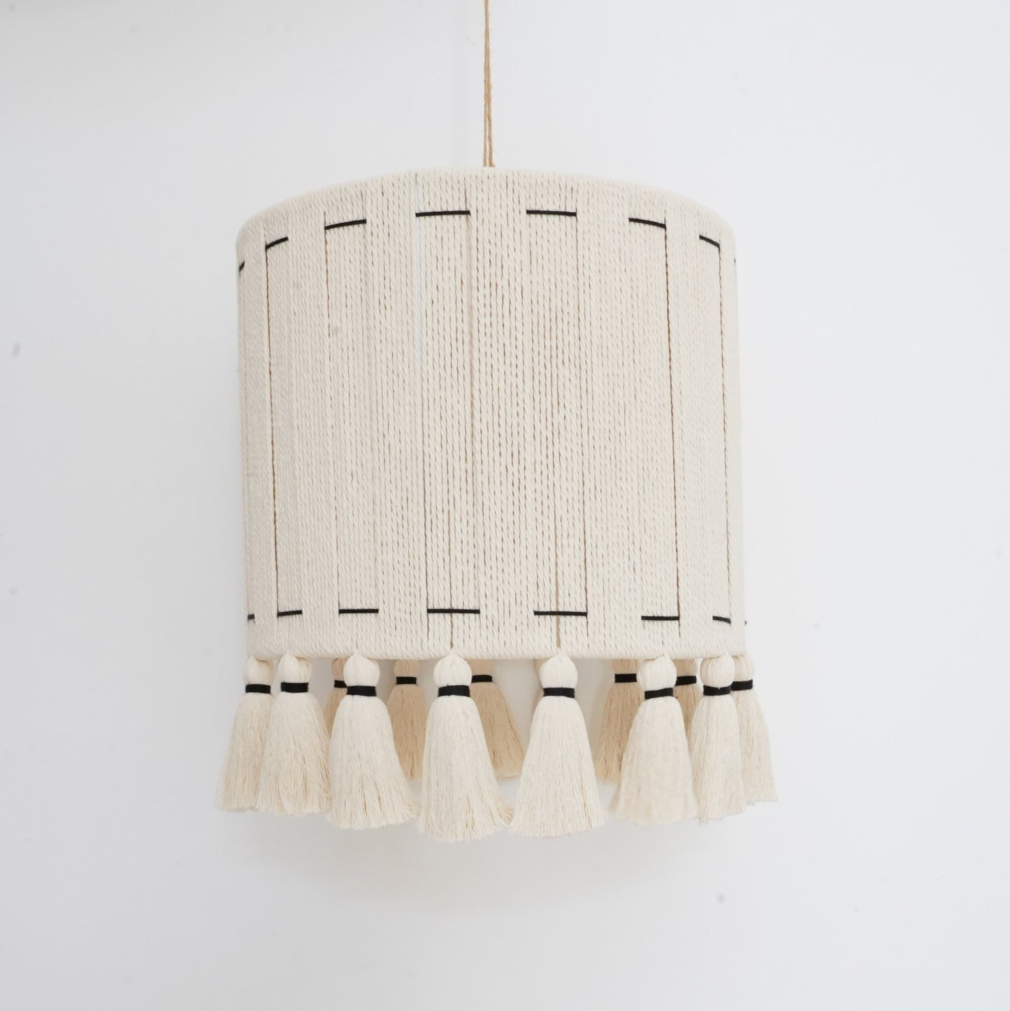 Ivory and black handcrafted cotton tassel and lampshade from the Hilo Collection