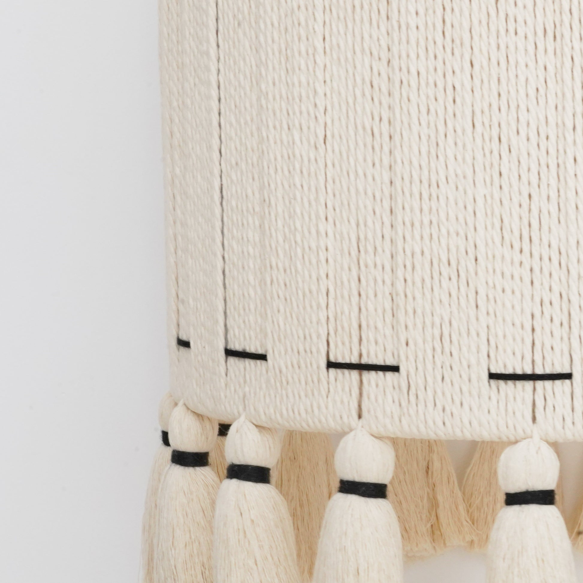 Ivory and black handcrafted cotton tassel and lampshade from the Hilo Collection