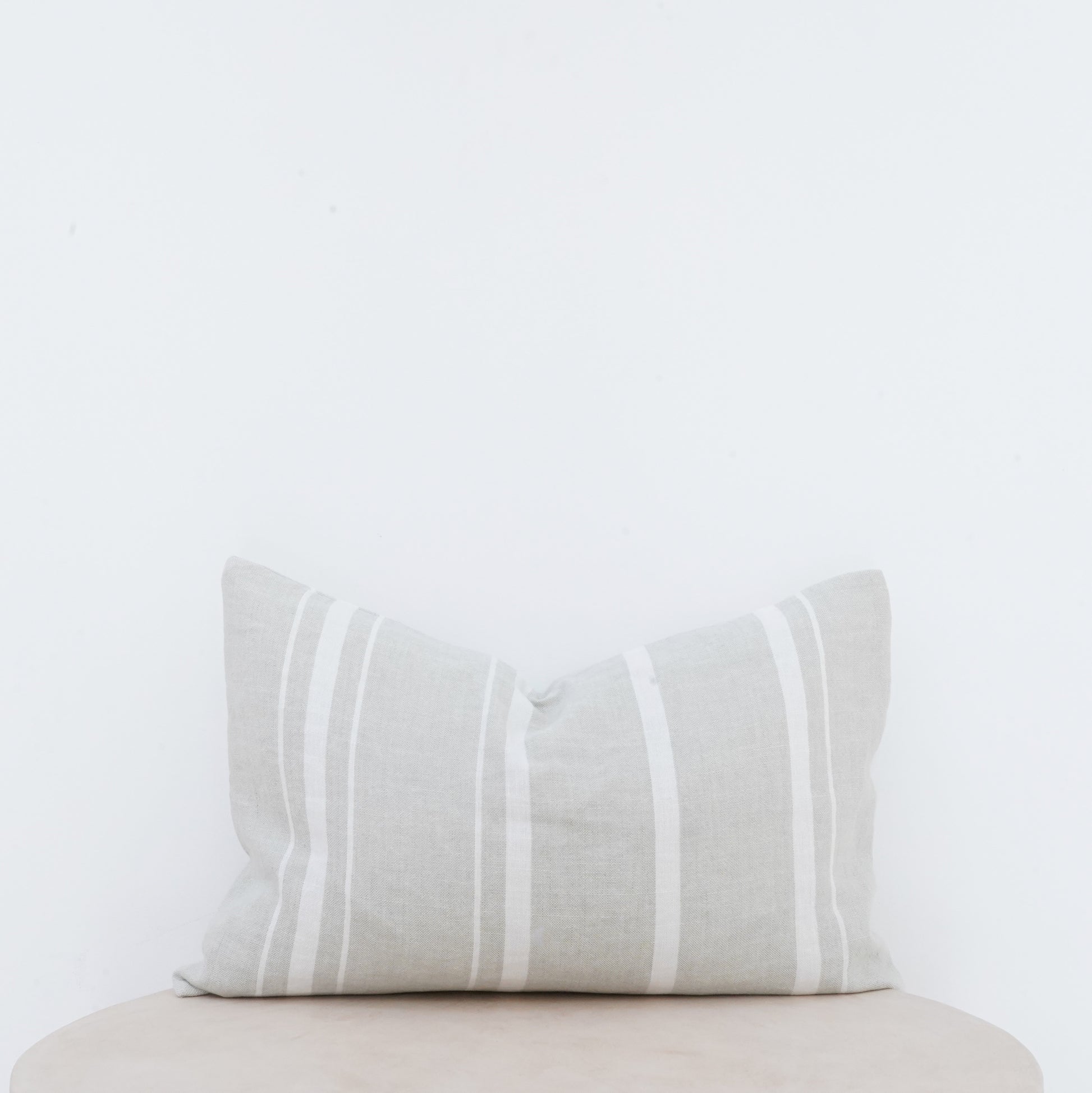 Willow linen cushion with French seam and soft natural finish.