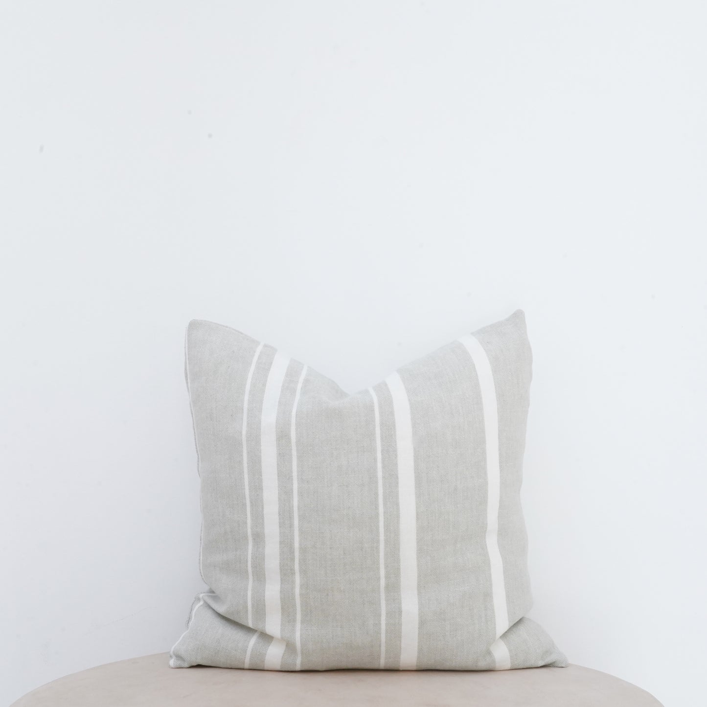 Willow linen cushion with French seam and soft natural finish.