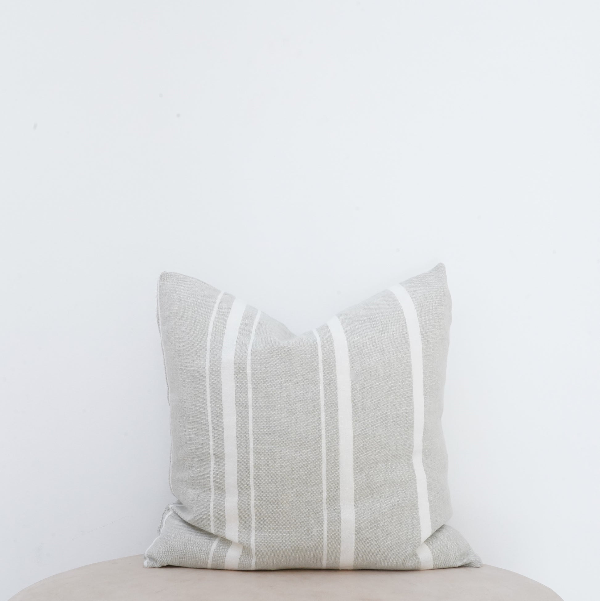 Willow linen cushion with French seam and soft natural finish.