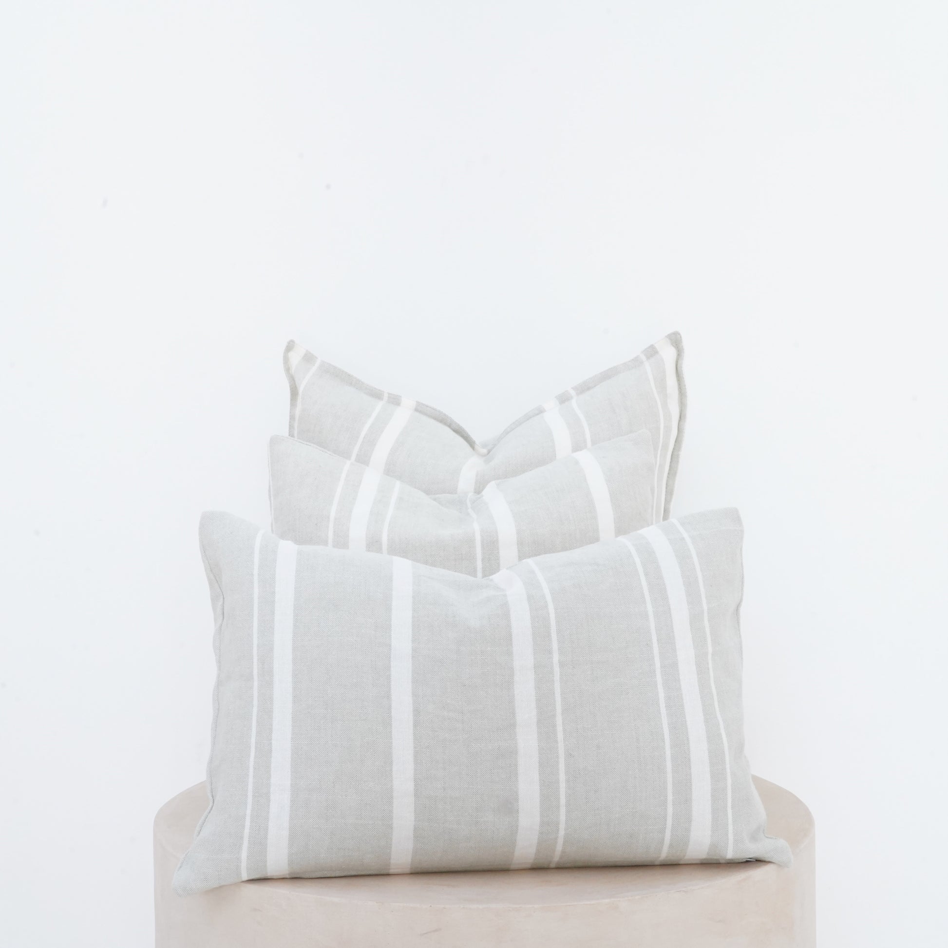Willow linen cushion with French seam and soft natural finish.
