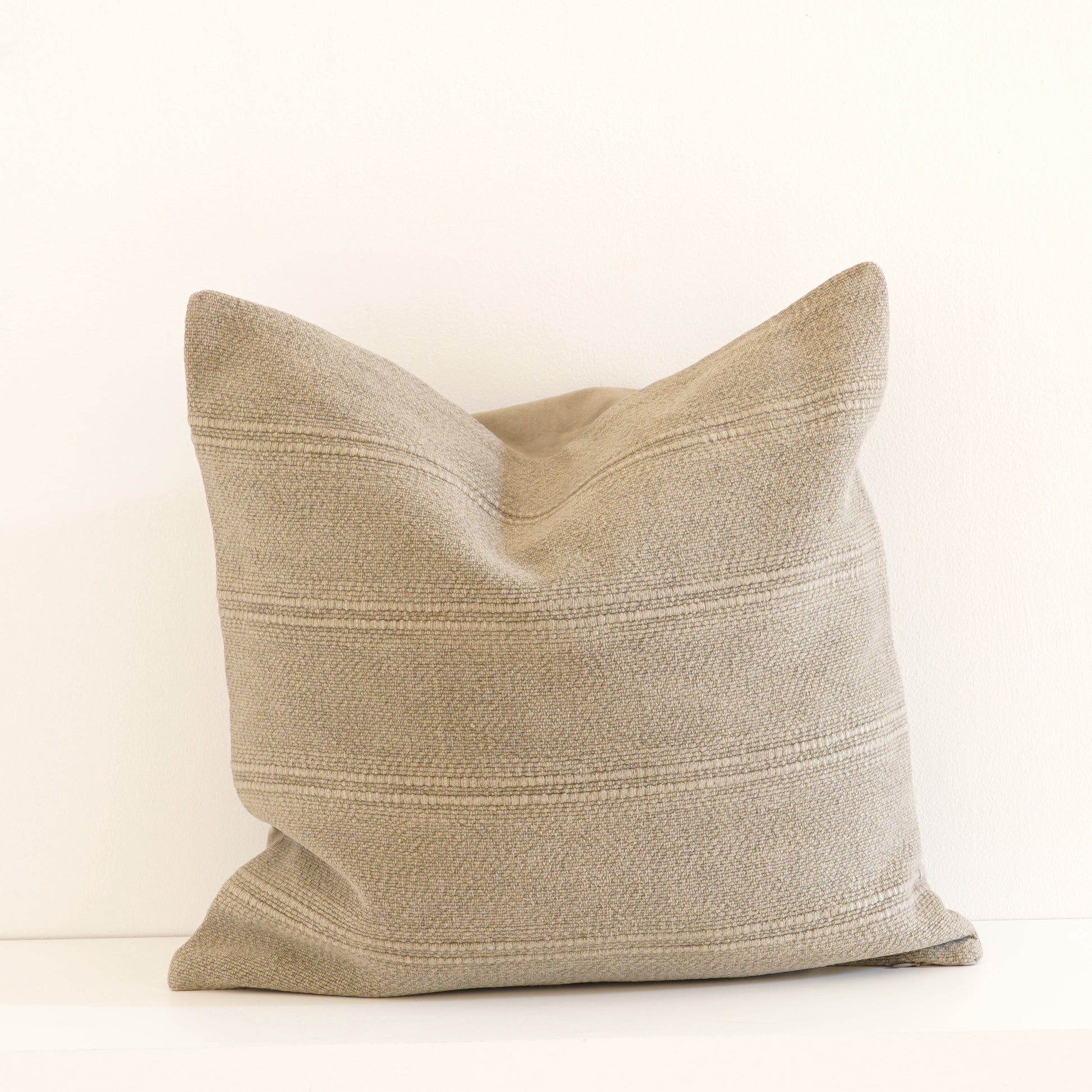 Cleo cotton-linen cushion in Ice, Shell, and Stone.