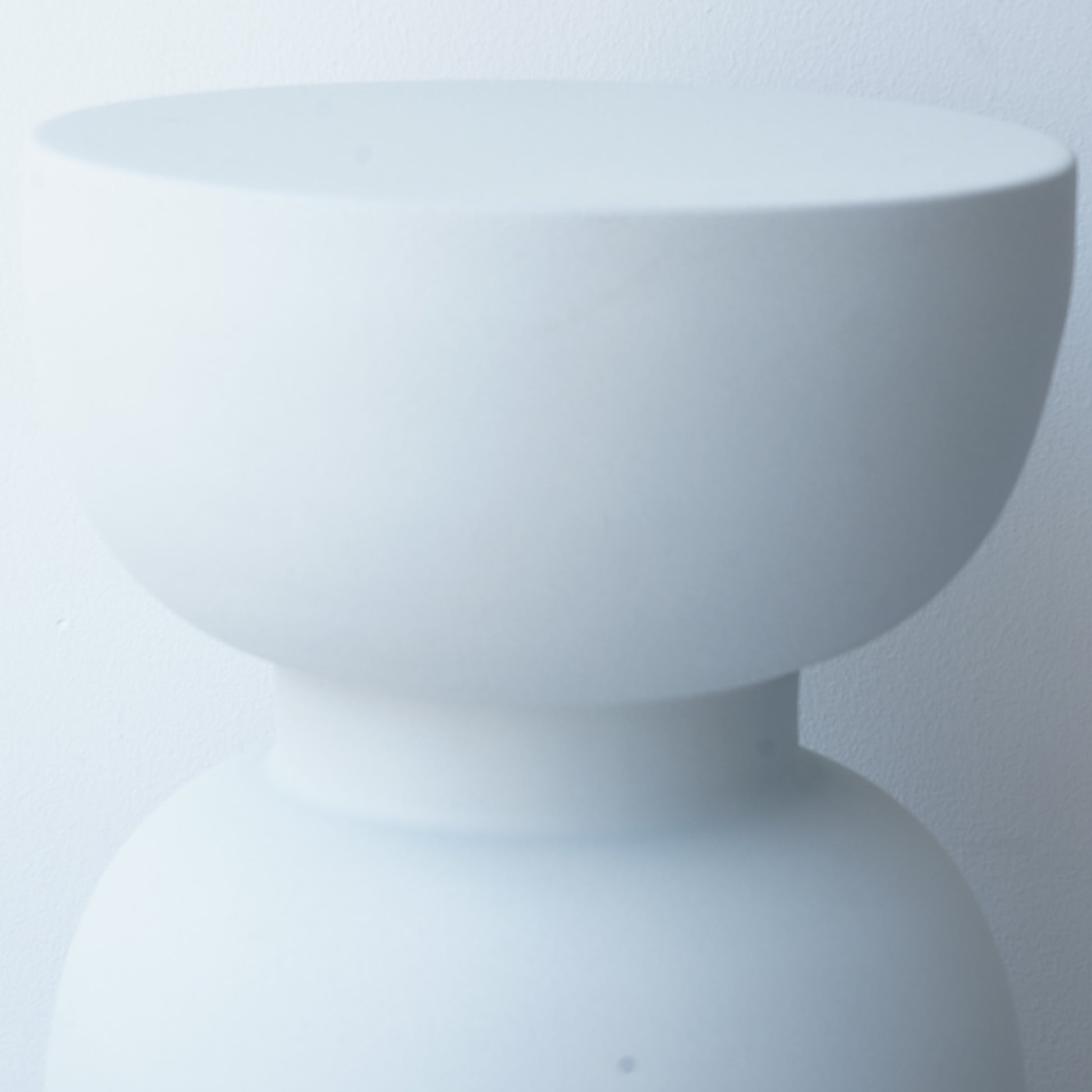 Note & Tone Side Tables in iron, Fog and Snow finishes, styled as a nested duo beside a modern sofa in Tribe Dubai showroom.