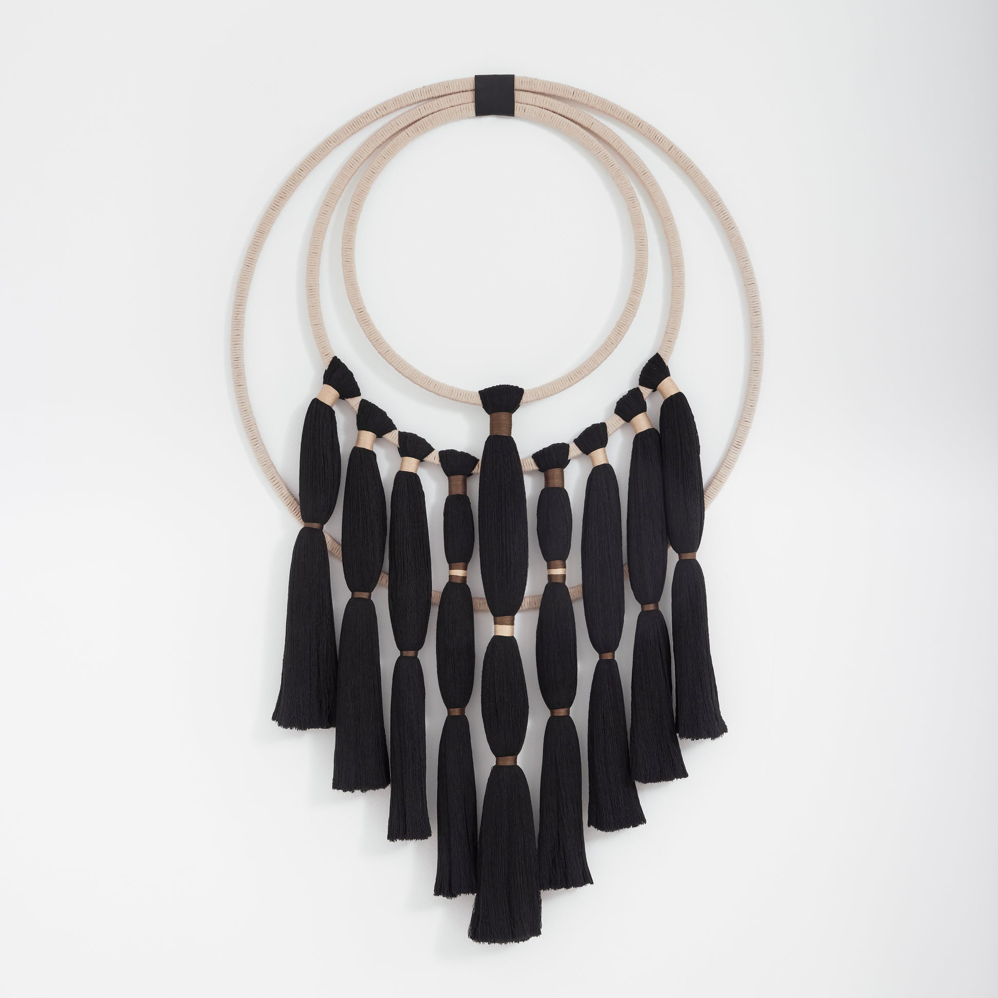 Charcoal and jute cotton wall hanging, handcrafted in natural fibres.
