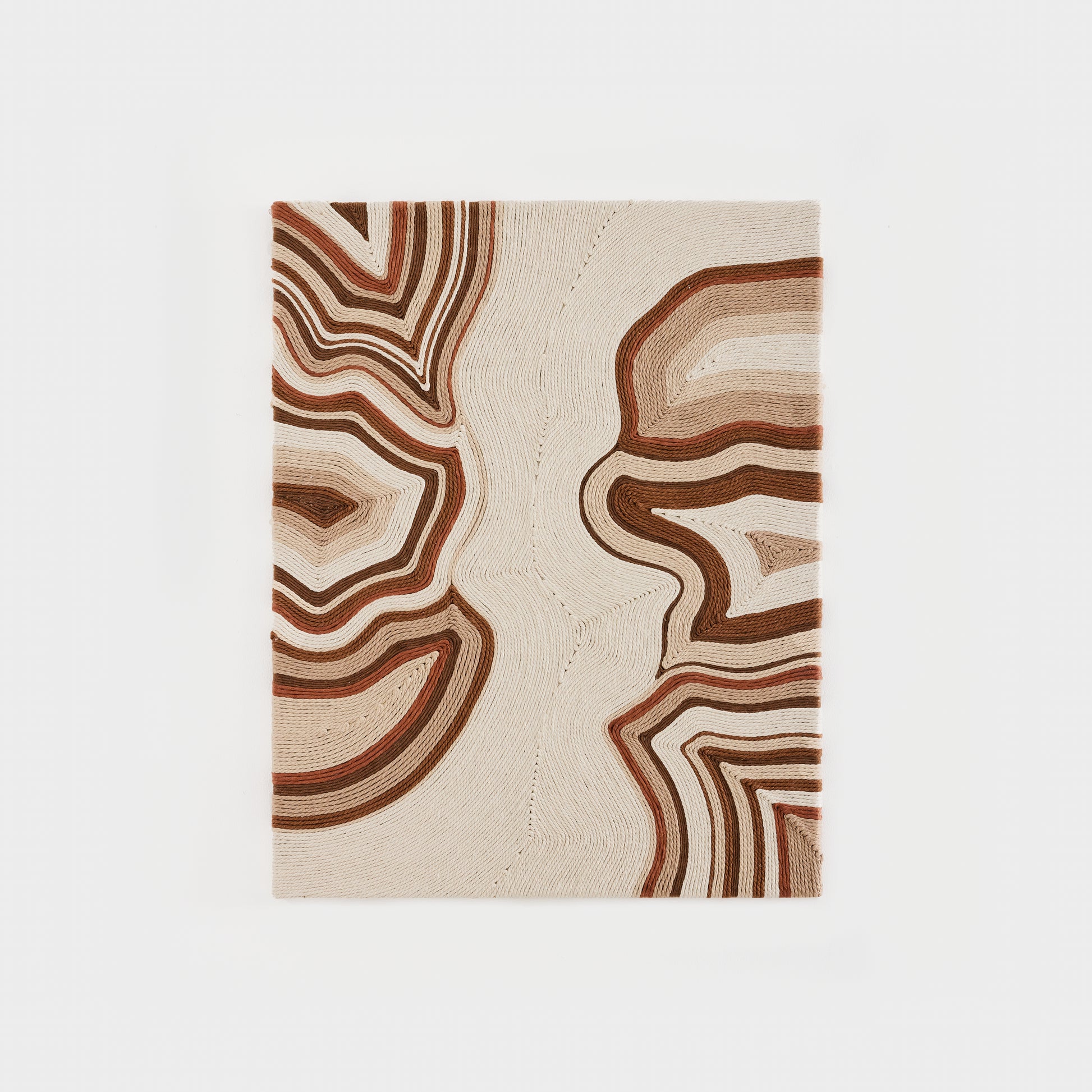 Handwoven cotton tapestry in ivory, beige, and green tones, blending modern and traditional design.