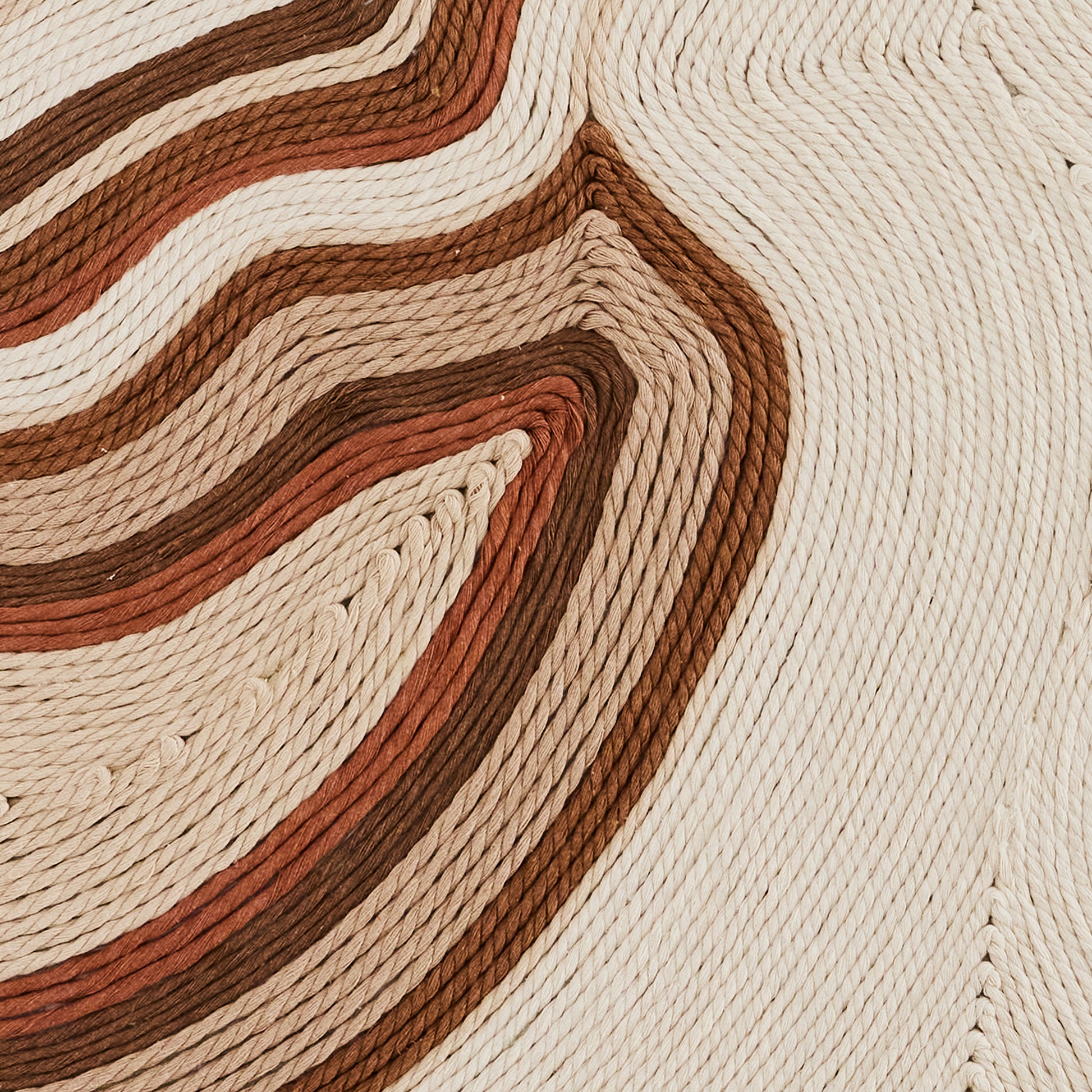Handwoven cotton tapestry in ivory, beige, and green tones, blending modern and traditional design.