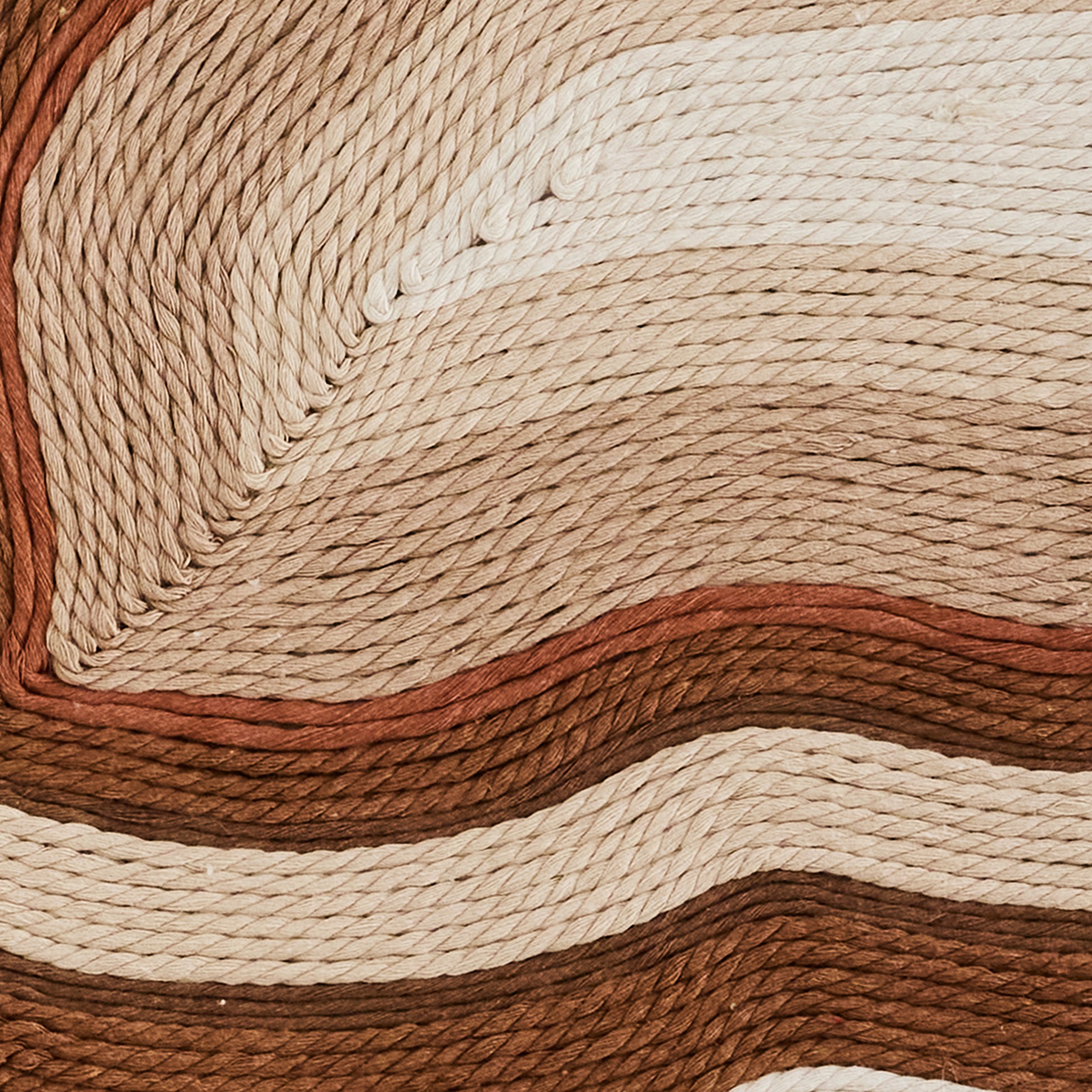 Handwoven cotton tapestry in ivory, beige, and green tones, blending modern and traditional design.