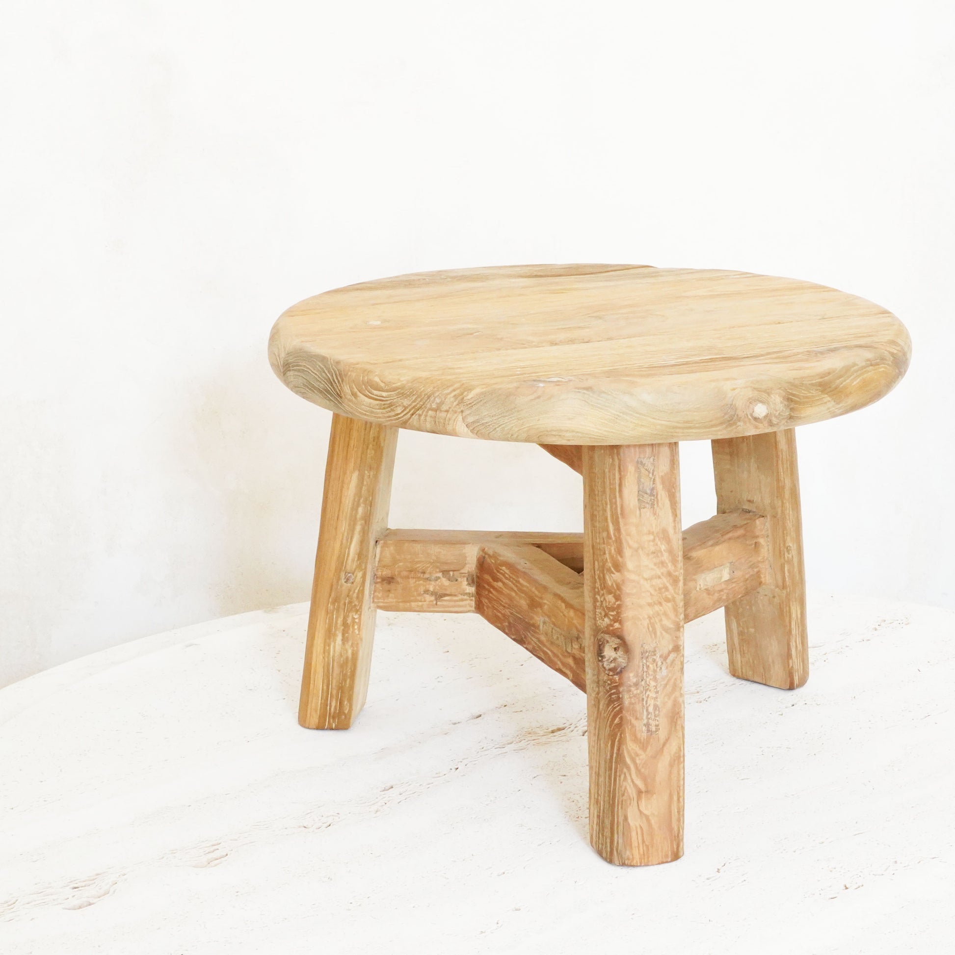 Reclaimed wood nesting tables in small, medium, and large sizes with a rustic, natural finish.