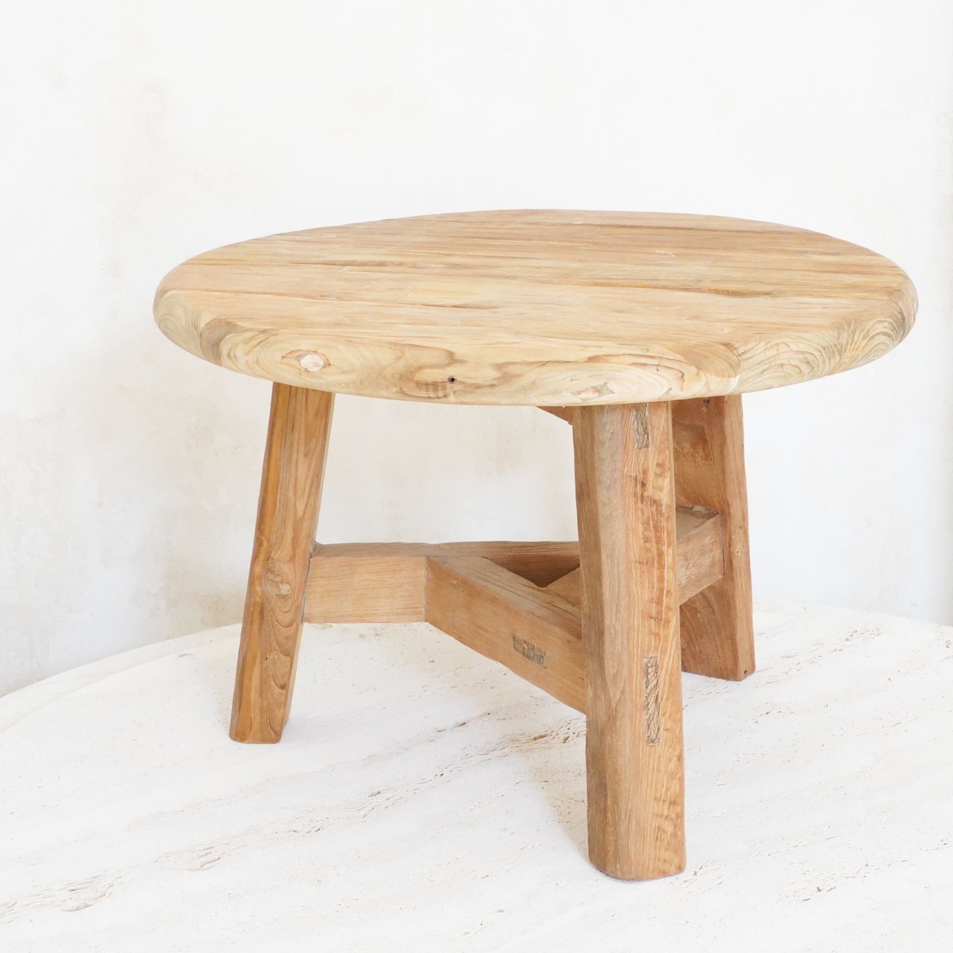 Reclaimed wood nesting tables in small, medium, and large sizes with a rustic, natural finish.