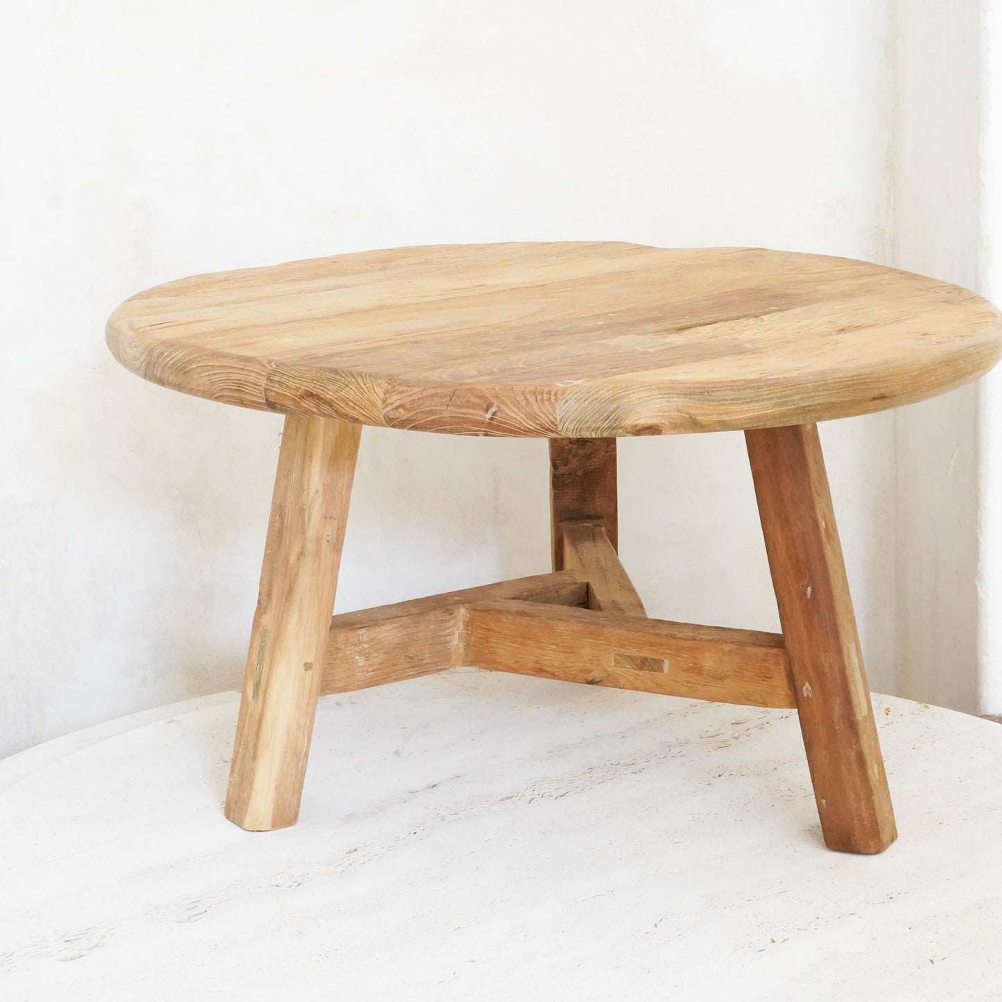 Reclaimed wood nesting tables in small, medium, and large sizes with a rustic, natural finish.