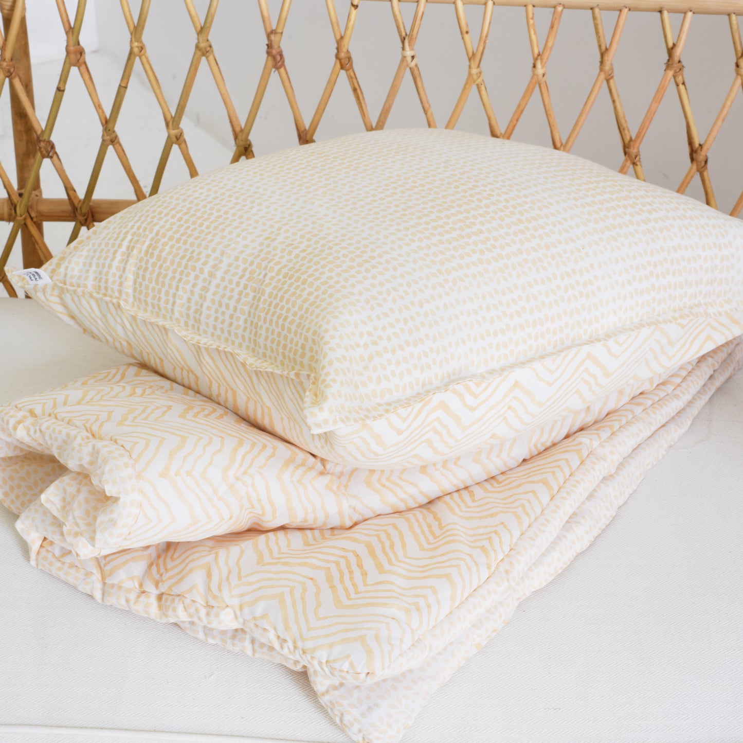 Peach hand-block printed Khushi bedding set with cushion inner.