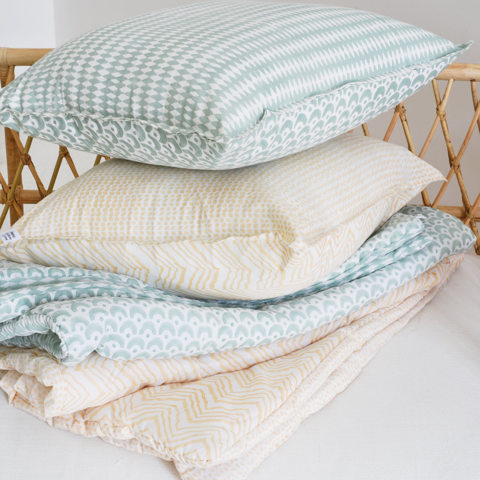 Peach hand-block printed Khushi bedding set with cushion inner.