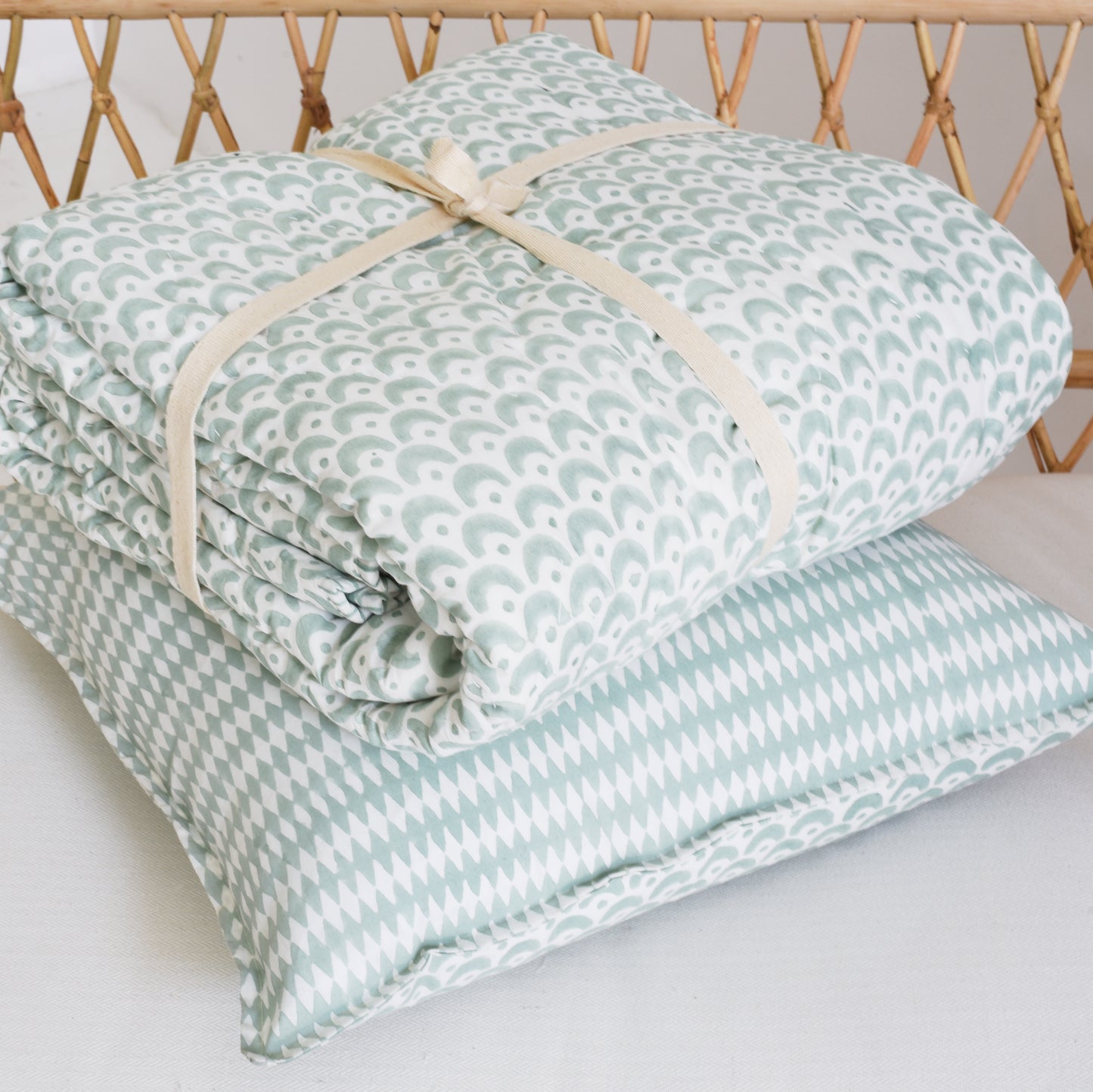 Sea-green hand-block printed Pyaar mattress with cushion inner.