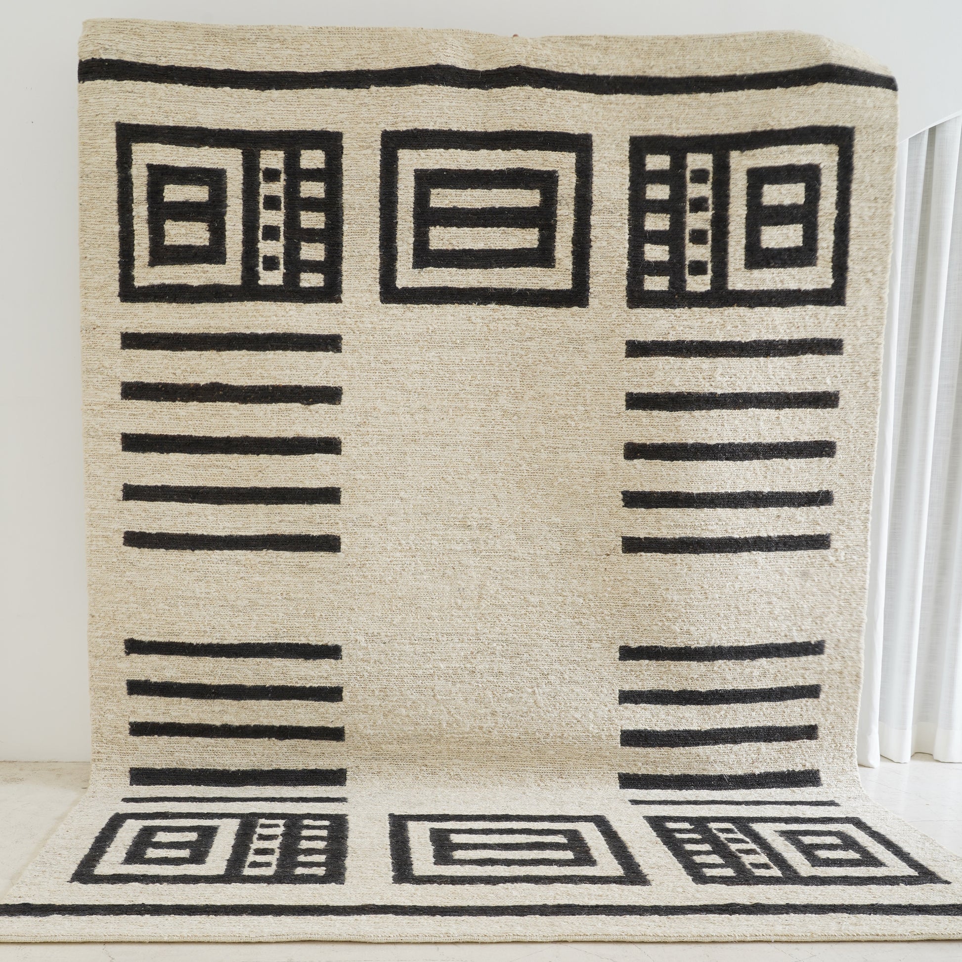Ivory and charcoal sustainable jute rug