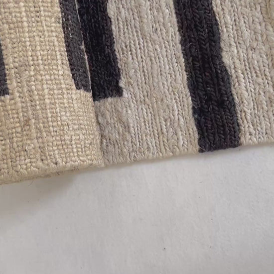 Ivory and charcoal sustainable jute rug