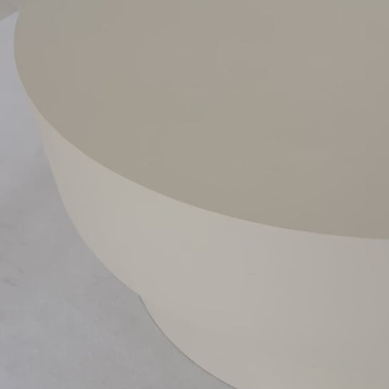 Round microcement cofee table from the Andre Collection, 90cm diameter, with smooth matte finish and minimalist silhouette set in a modern living space.